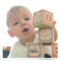 Child playing with letter blocks.