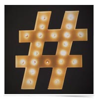 Hashtag sculpture lit up.