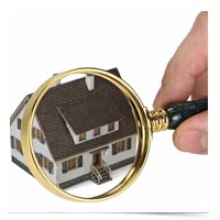 Image of magnifying glass on house.