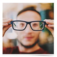 Man looking through glasses.